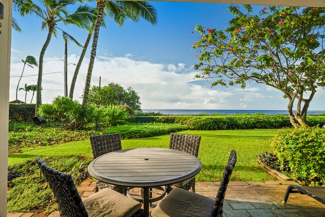 view of patio with a water view