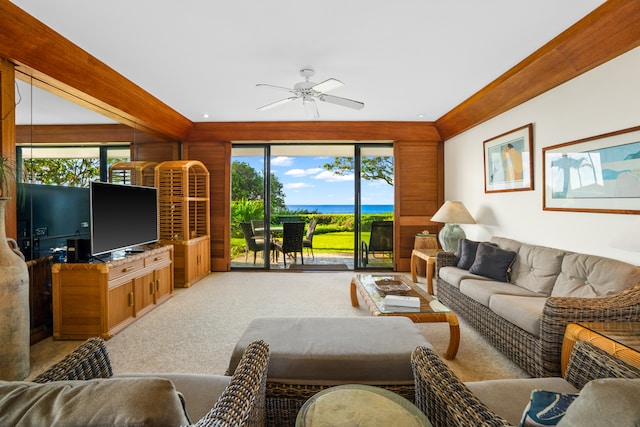 carpeted living room with a wealth of natural light and ceiling fan