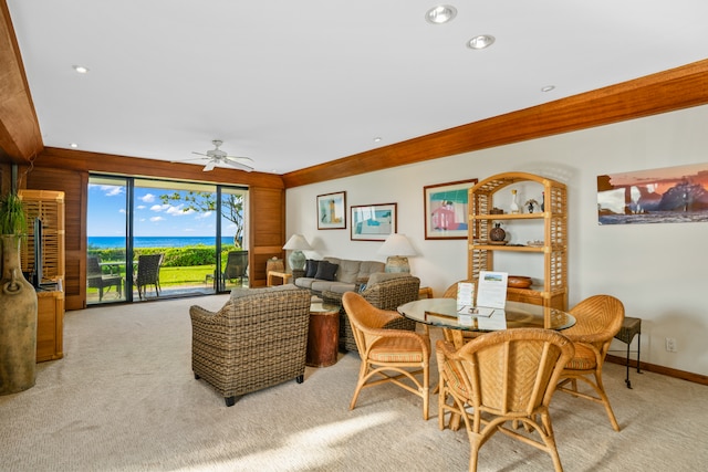 interior space featuring light colored carpet and ceiling fan