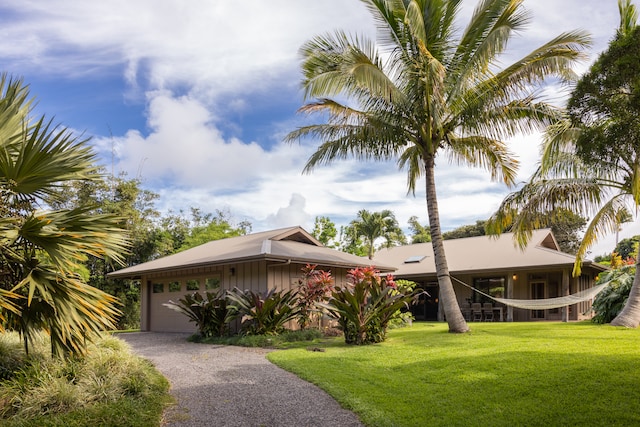 view of front of property with a garage and a front yard