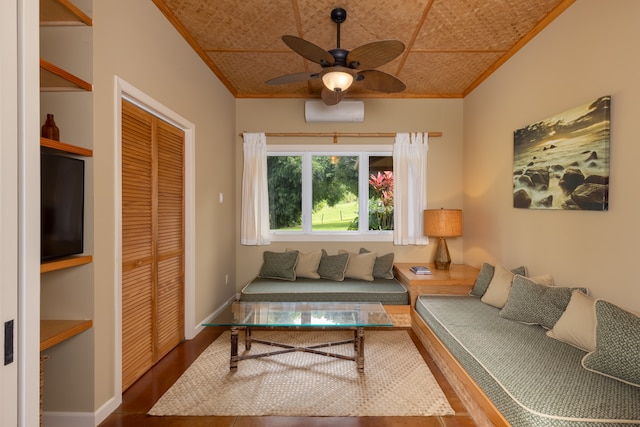 living room with hardwood / wood-style flooring, ceiling fan, and crown molding