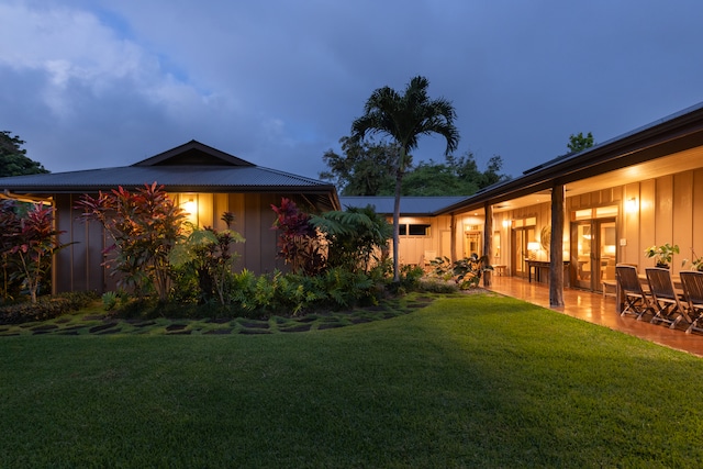 view of yard at dusk