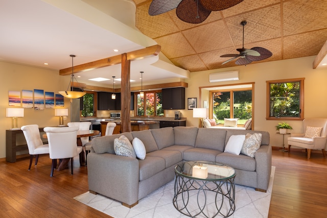 living room with light wood-type flooring, ceiling fan, and plenty of natural light