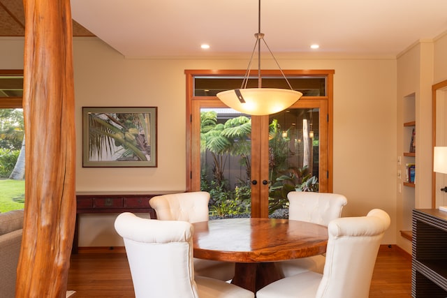 dining area with wood-type flooring