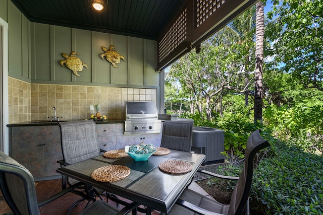 view of patio / terrace with a grill, area for grilling, and cooling unit