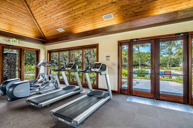 workout area with a wealth of natural light, french doors, light carpet, and wooden ceiling