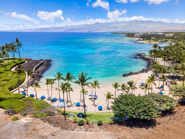 water view featuring a mountain view and a beach view