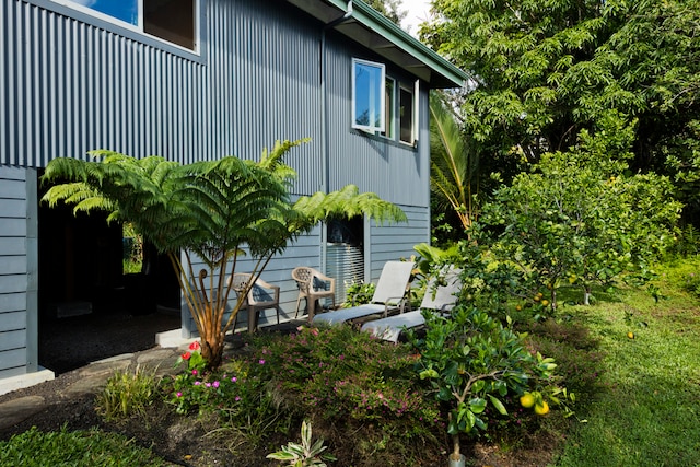 view of side of property with a patio