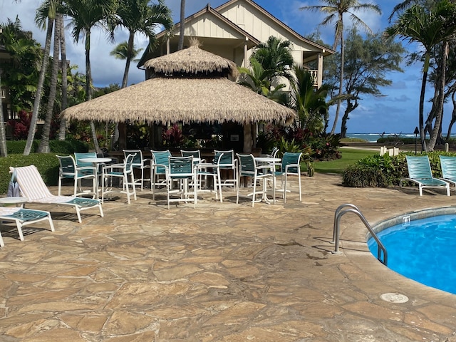 view of swimming pool with a patio