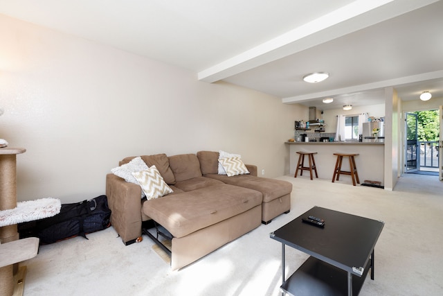 living room featuring light carpet and beam ceiling