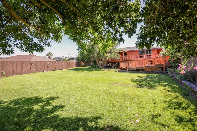 view of yard with a wooden deck