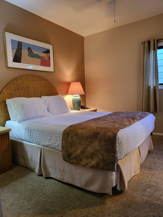 bedroom with ceiling fan and carpet flooring