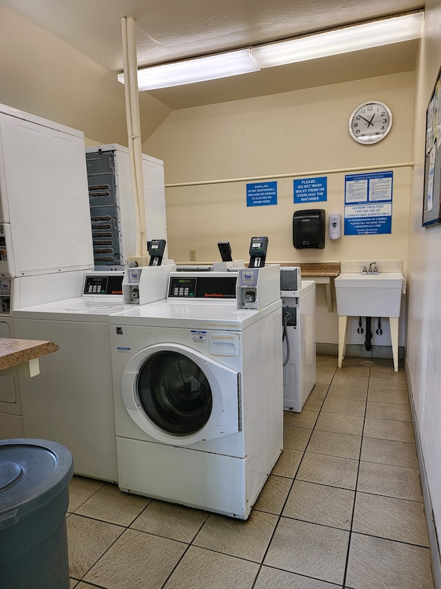 washroom with stacked washer and dryer, separate washer and dryer, and light tile patterned floors