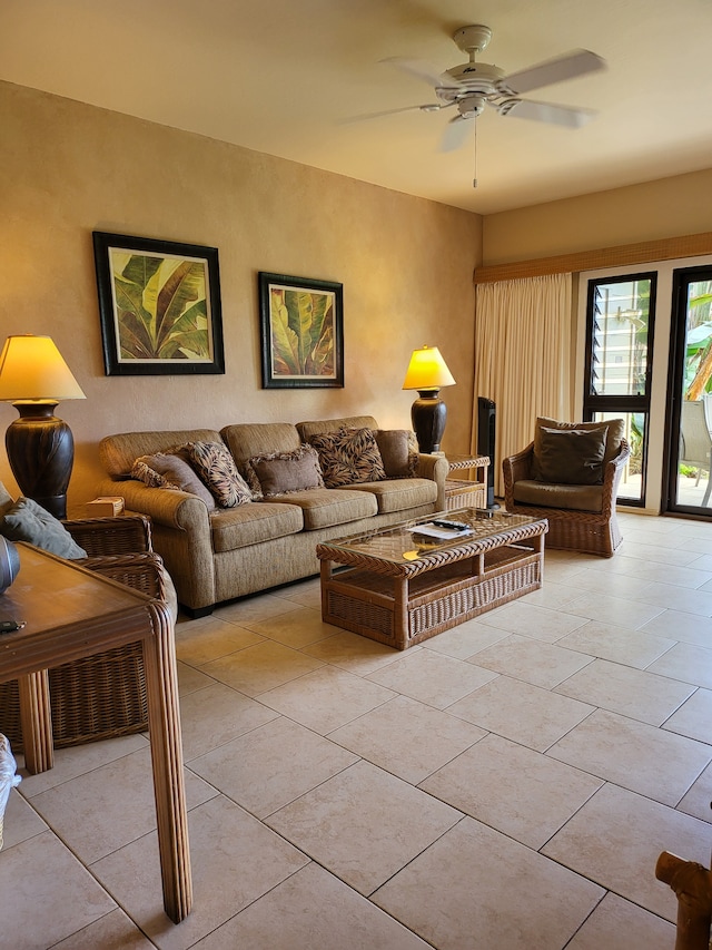 tiled living room featuring ceiling fan