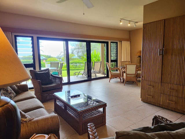 living room with light tile patterned flooring and ceiling fan