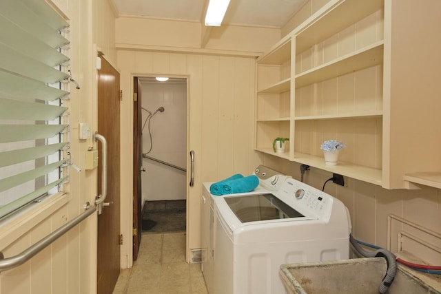 washroom with light tile patterned flooring and separate washer and dryer