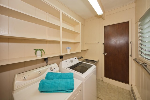 laundry area featuring sink and washing machine and clothes dryer