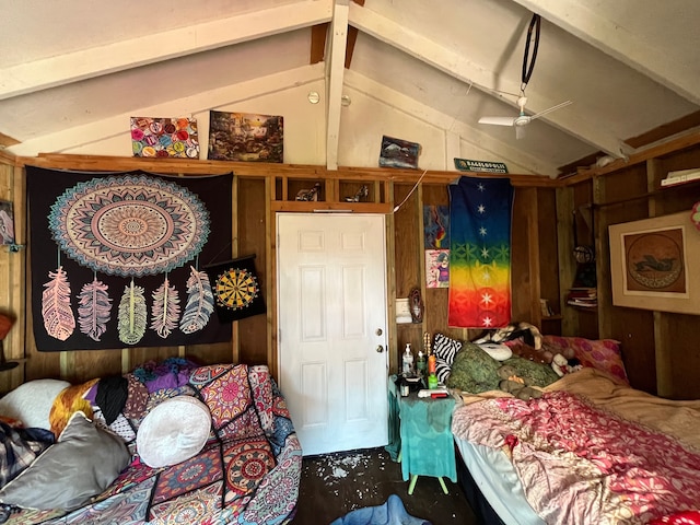 bedroom with wooden walls and lofted ceiling with beams