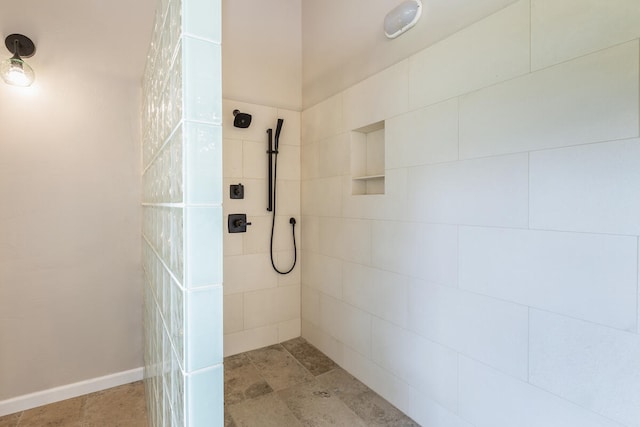 bathroom with tiled shower