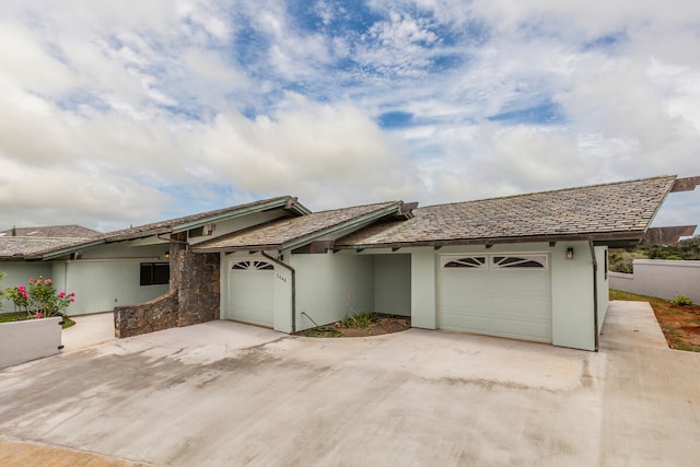 single story home featuring a garage