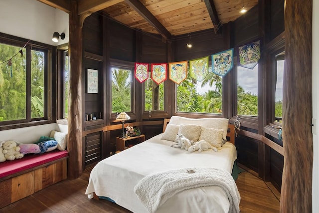 bedroom featuring lofted ceiling with beams, dark hardwood / wood-style flooring, and wood ceiling