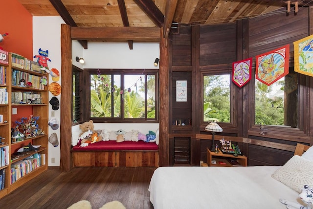 bedroom with beamed ceiling, wooden ceiling, and dark hardwood / wood-style floors