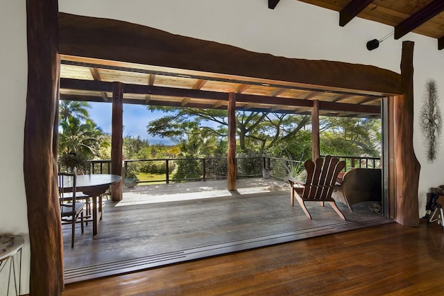 entryway with vaulted ceiling with beams, wooden ceiling, and dark wood-type flooring