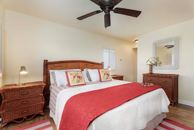 bedroom with wood-type flooring and ceiling fan