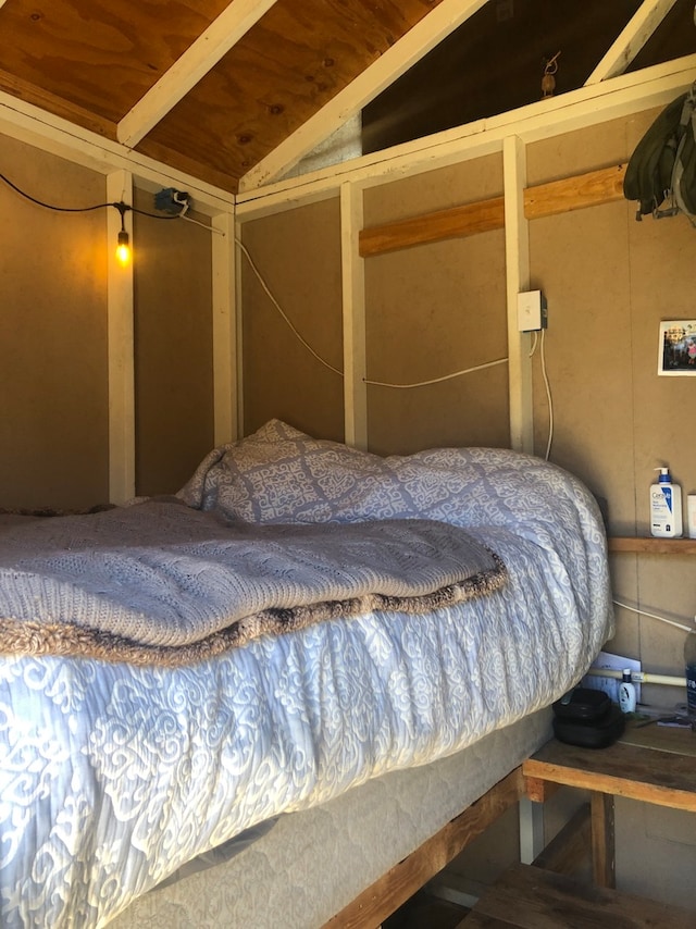 bedroom with vaulted ceiling and wooden ceiling