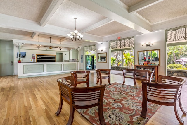 interior space with beamed ceiling, a textured ceiling, light wood-type flooring, and coffered ceiling