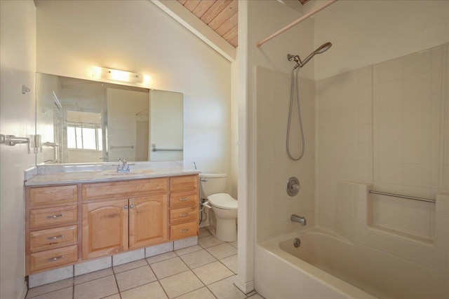 full bathroom with vanity, lofted ceiling, tile patterned floors, tiled shower / bath combo, and toilet