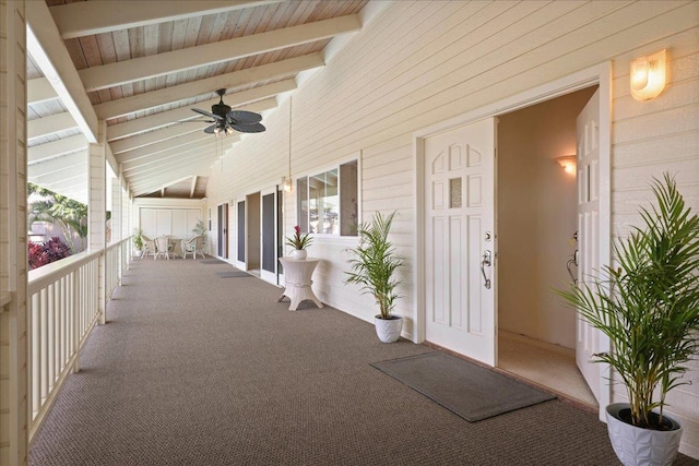 view of patio with ceiling fan and a porch