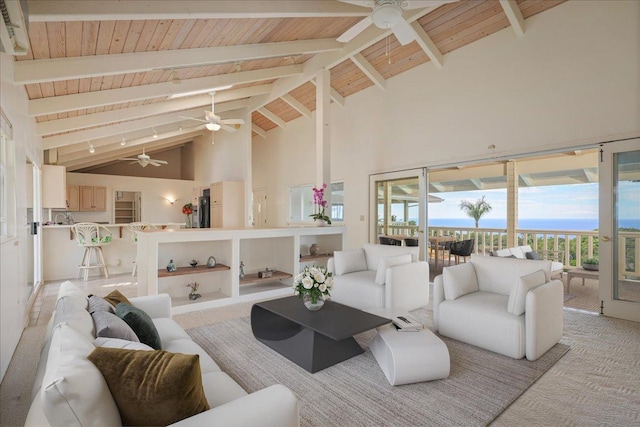 carpeted living room featuring beam ceiling, high vaulted ceiling, and wooden ceiling