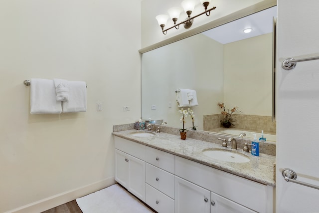 bathroom featuring hardwood / wood-style floors and vanity