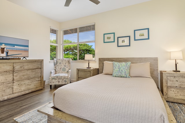 bedroom featuring hardwood / wood-style floors and ceiling fan