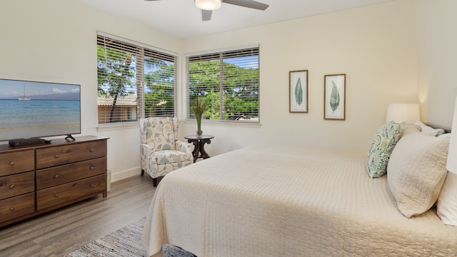 bedroom with wood-type flooring and ceiling fan