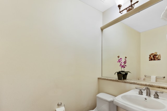 bathroom with sink and toilet