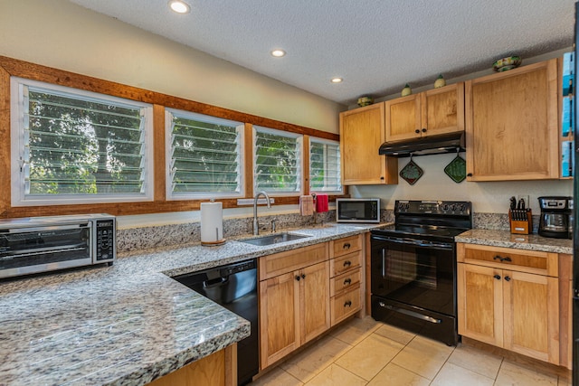 kitchen featuring light tile patterned floors, sink, a textured ceiling, and black appliances