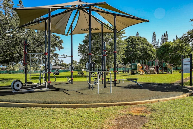 view of jungle gym featuring a lawn