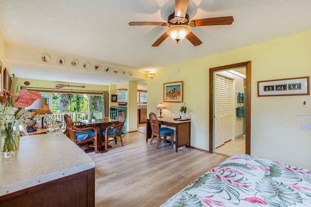 bedroom with ceiling fan and light wood-type flooring