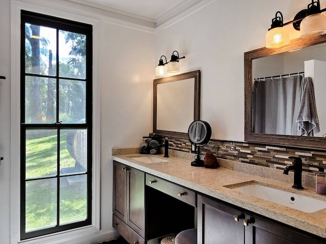 bathroom featuring a shower with curtain, backsplash, vanity, and ornamental molding