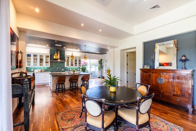 dining space with dark hardwood / wood-style floors