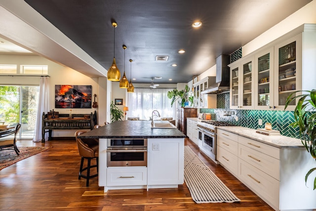 kitchen featuring white cabinets, dark wood-type flooring, sink, and stainless steel appliances