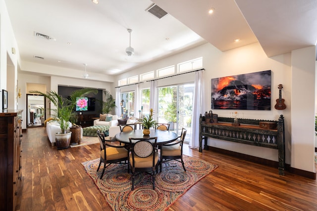 dining space featuring dark hardwood / wood-style flooring