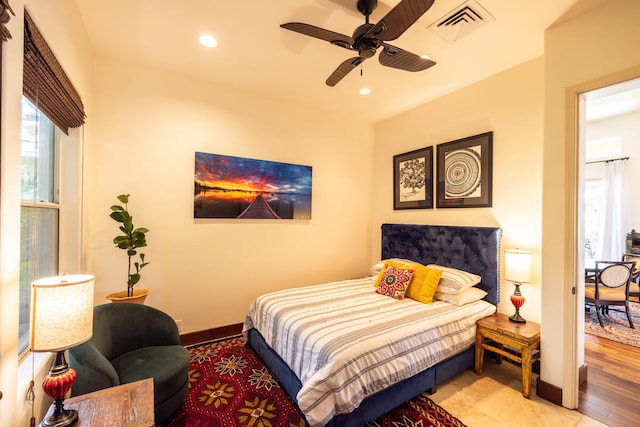 bedroom with light wood-type flooring and ceiling fan