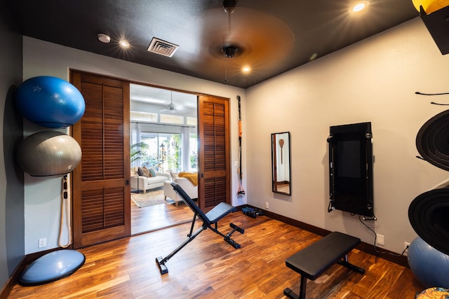 exercise area with wood-type flooring