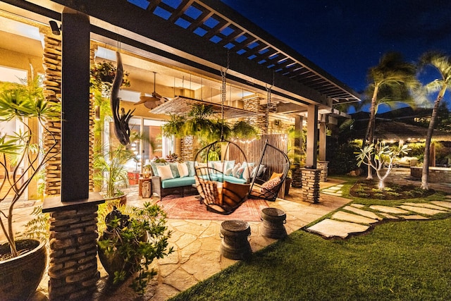 patio at twilight featuring an outdoor hangout area