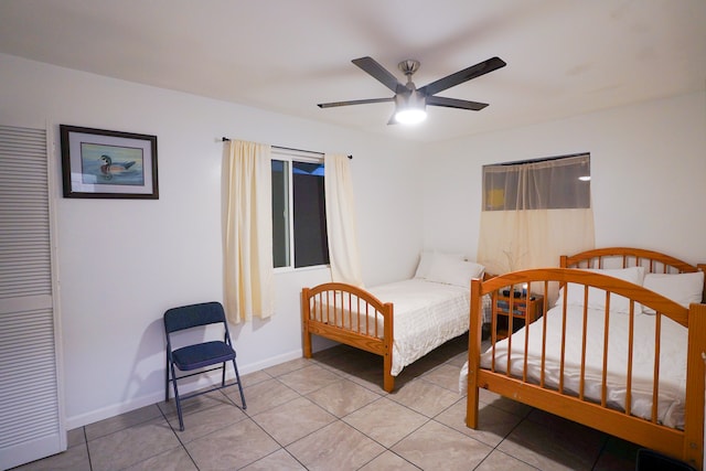 bedroom featuring ceiling fan and light tile patterned floors