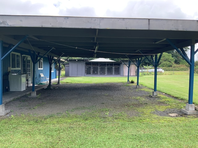 exterior space with a shed and washer / dryer