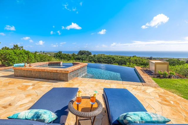 view of swimming pool with a water view, an in ground hot tub, and a patio